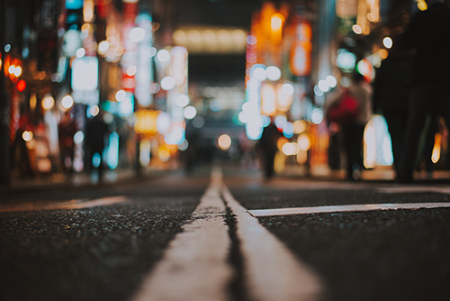 photo of a road leading to a city