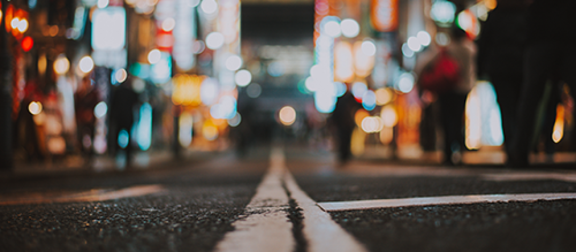 photo of a road leading to a city